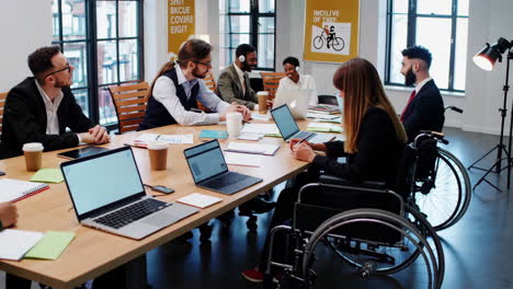 diverse business team collaborating in an inclusive office meeting