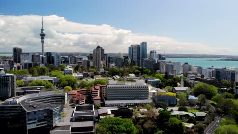 Auckland-CBD-aerial-cityscape-of-Sky-Tower,-skycrapers-and-city-parks