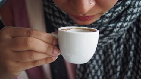 woman drinking coffee