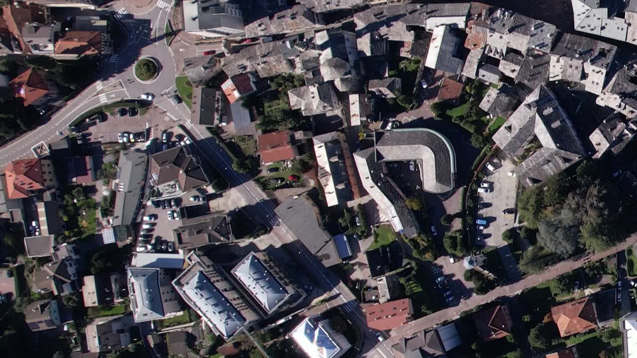 Scenic aerial view of Italian Alps village surrounded by homes