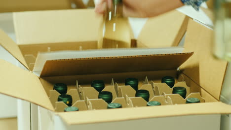 worker boxing white wine