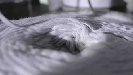 Closeup-Of-Recycled-Textiles-Manufacturing,-Sustainable-Fabric-And-Thread-Production