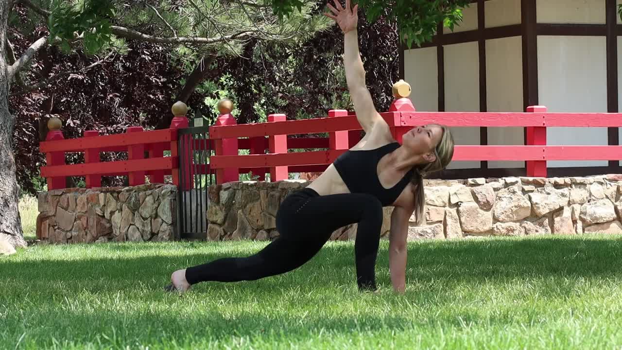 A young woman works out utilizing yoga to build balance and focus as part of her healthy lifestyle