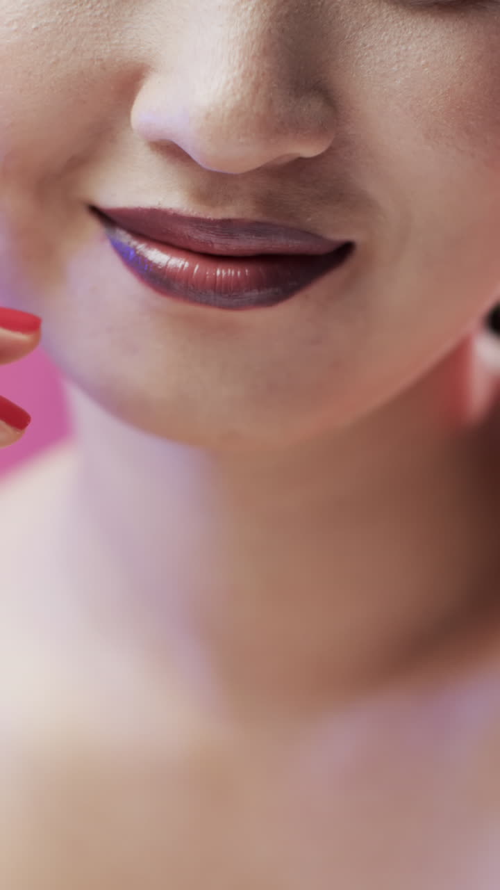 Vertical video of asian woman with make up smiling, copy space, slow motion