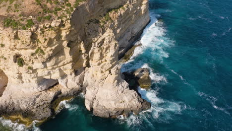 Drone-shot-flying-around-the-rocky-Dingli-cliffs,-sunny-day-in-Malta,-Europe