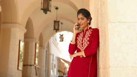 portrait of a beautiful indian woman talking on the phone