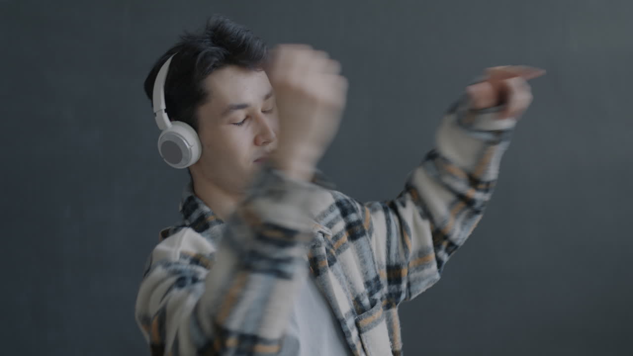 Young Man Dancing with Headphones