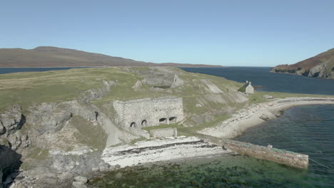 an aerial view of ard neakie abandoned lime kilns on a sunny summer's day