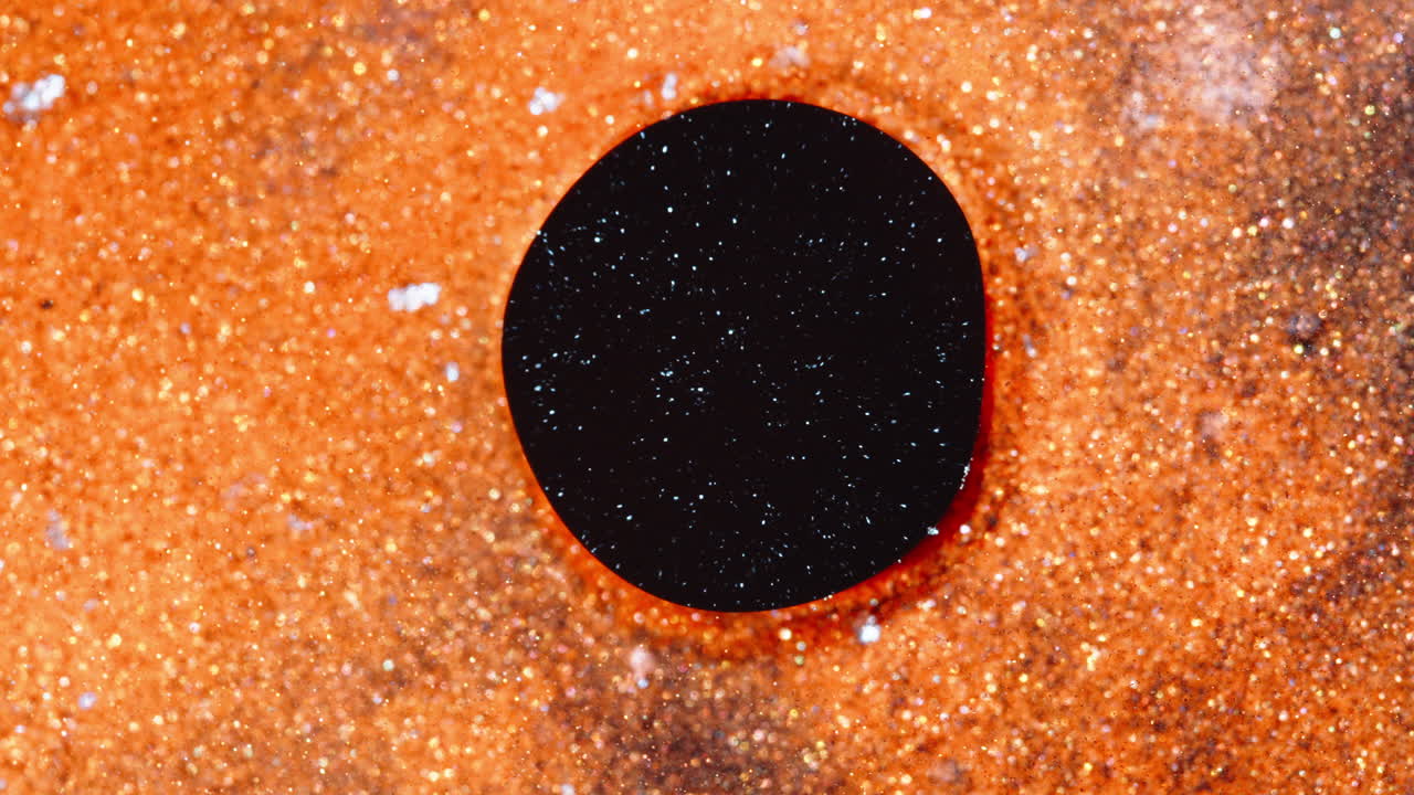 Vibrant ink mixing in macro view, showcasing dynamic color patterns