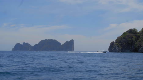 boats along the edge of the phi phi islands in thailand