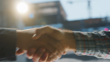 two people shaking hands, signifying agreement or partnership