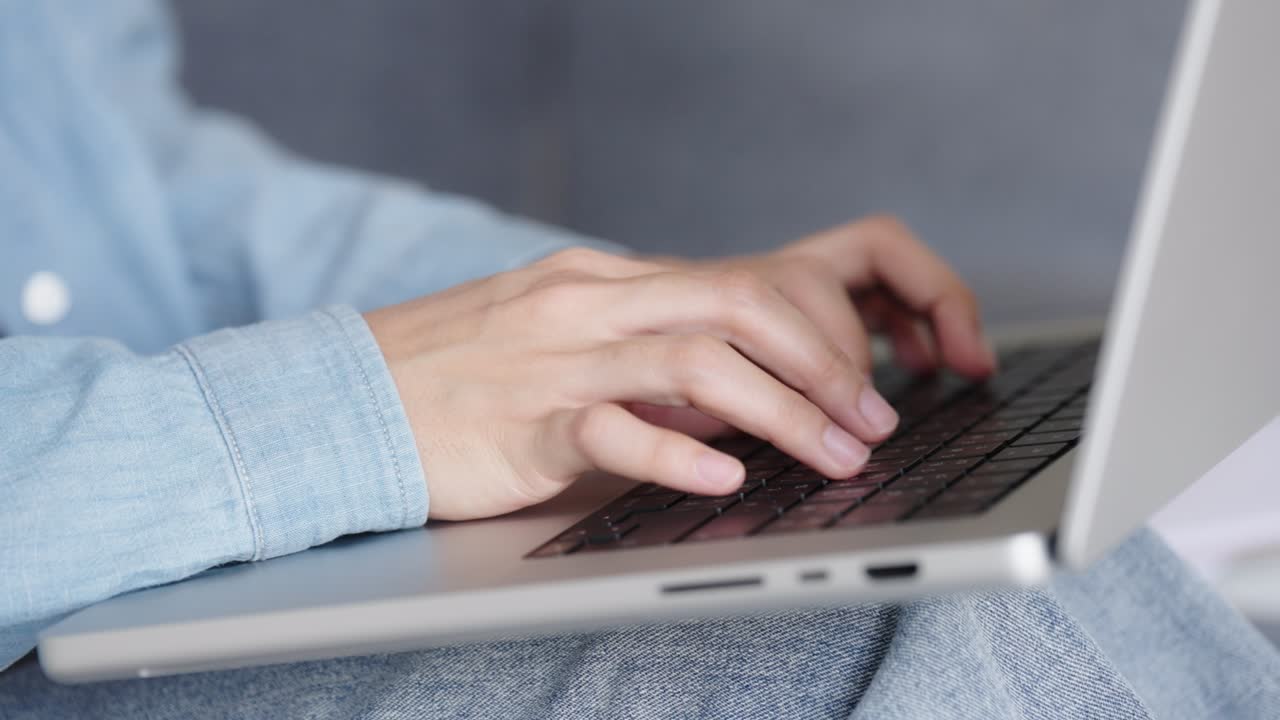 Two Asian girls student partners are working on a laptop help study together