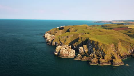 Aerial-Of-Scottish-Coast,-St-Abbs-Head-And-Lighthouse-Near-Scottish-Borders,-Scotland,-United-Kingdom