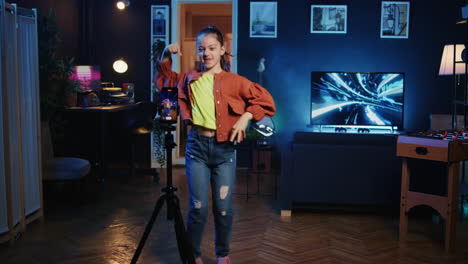 Kid-media-star-recording-trendy-dance-video-clip-for-social-media,-entertaining-audiences