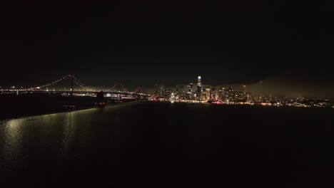 aerial view approaching the skyline of san francisco, foggy night in usa