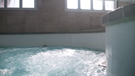 slow motion pull-out shot of a thalassotherapy spa at the state of the art spa