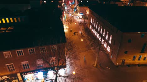 Aerial-hyperlapse-showing-buildings,-cars-and-city-landscape