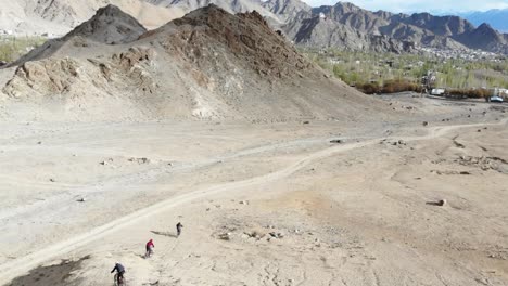 Aerial-view-of-group-cycling-on-mountains