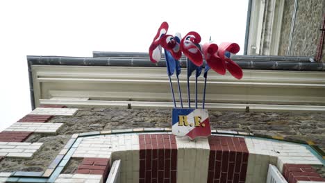 building exterior with flags and sign