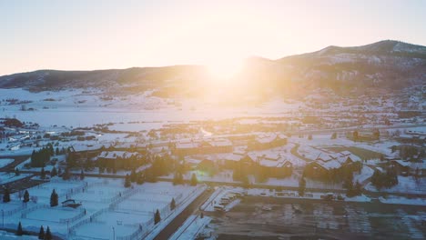 Beautiful-Dusk-View-With-Sun-Setting-Over-Snow-Covered-Mountains-And-City-Landscape-In-Steamboat-Springs-Colorado