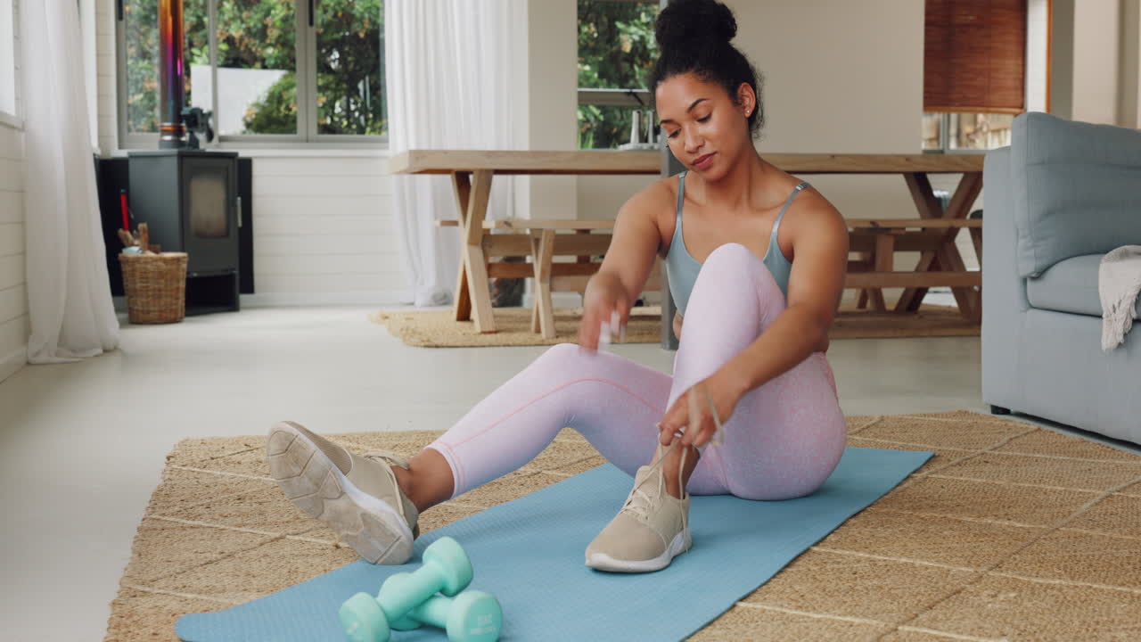 Premium stock video - Home, workout and girl preparation with shoes tie