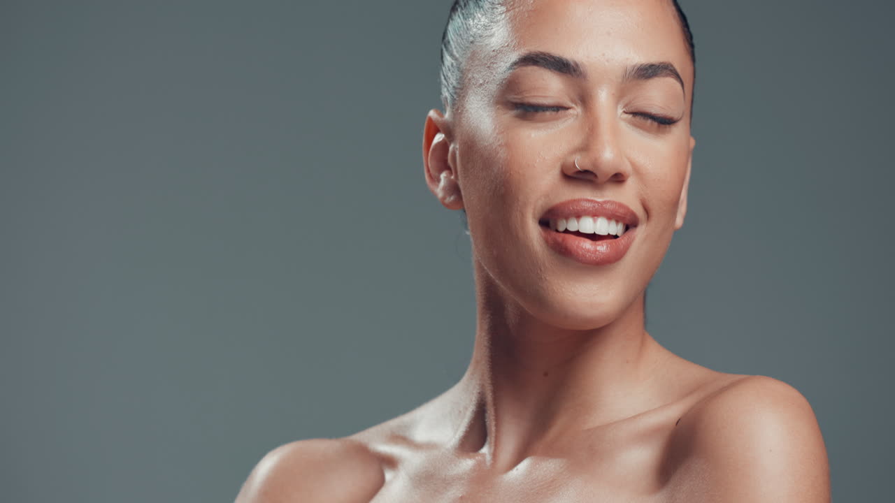 Beautiful woman smiling and showing off her healthy skin