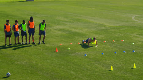 football players exercising in the field 4k