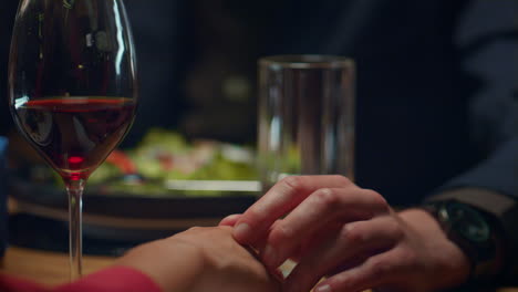 love couple holding hands at romantic restaurant dinner date. intimate concept.