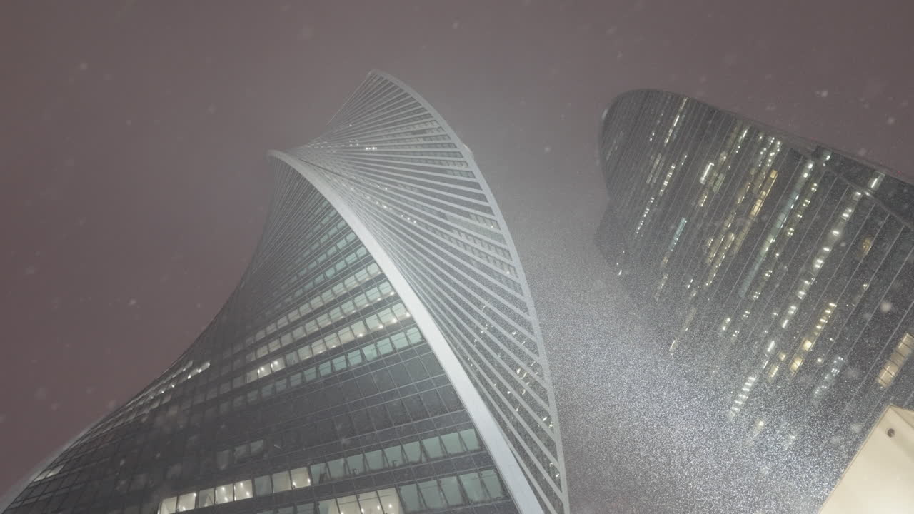 Modern Skyscrapers in a Snowstorm at Night