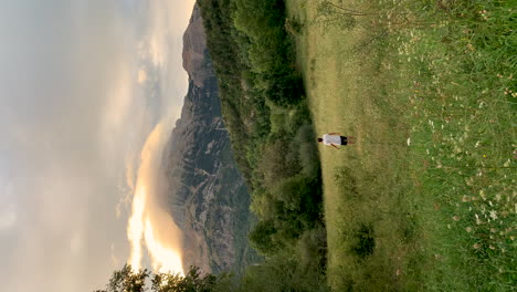 vertical young trekker adventurer explorer travelling in the alps pyrenees of spain france european mountain landscape fresh unpolluted nature holiday travel destination