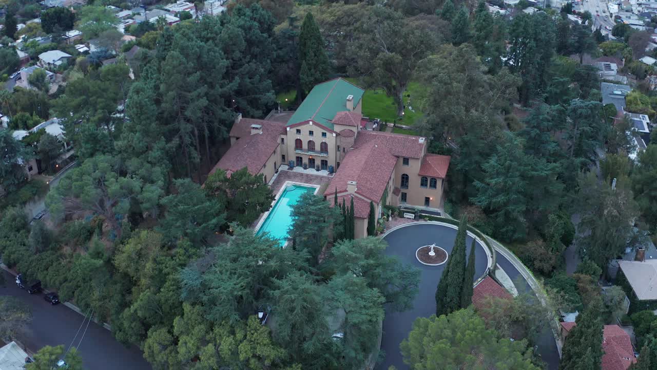 Aerial bird's eye panning shot of the historic Paramour Estate at low light in Hollywood, California. 4K
