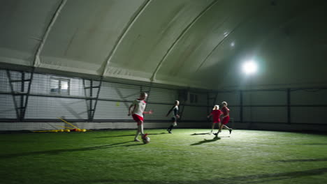 young girls playing indoor soccer