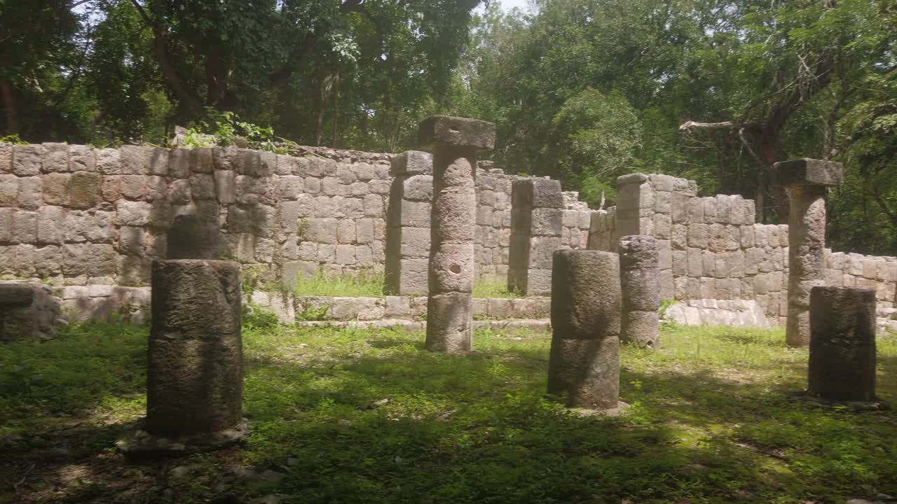 Gimbal panning shot of column ruins at Chichen Itza in Yucatan, Mexico. 4K