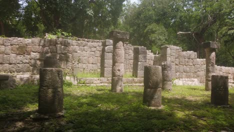 gimbal panning shot of column ruins at chichen itza in yucatan, mexico. 4k