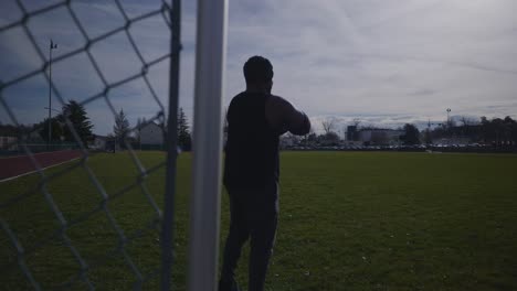 Male-In-Deep-Thought-Looking-Into-Distance-With-Arms-Crossed---Strong-Athletic-Muscular-Black-Man-Fitness-Outdoor-Training-Preparation-In-4K