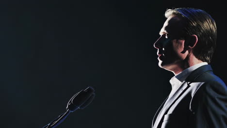 man speaking at a public event