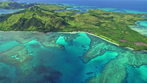 Epic-reveal-shot-of-tropical-Nacula-island-and-coral-reef,-Yasawa,-Fiji