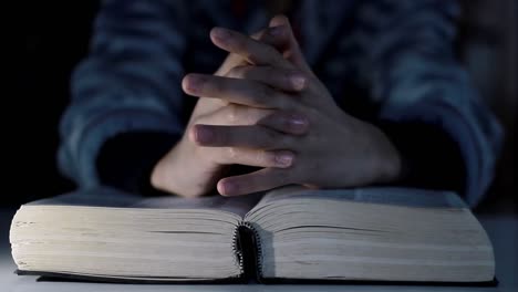 praying-to-God-with-bible-faithfully-worshipping-with-people-stock-footage-stock-video