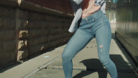 woman dancing in a city alley