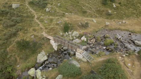 panoramic view of a little cute bridge and a river on the mountains in la cerdanya