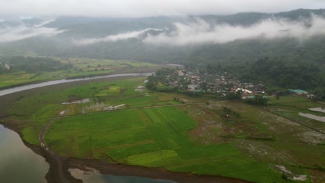 Remote-Landscape-Of-A-Village-Surrounded-By-Misty-Forest-And-River-In-Catanduanes,-Philippines