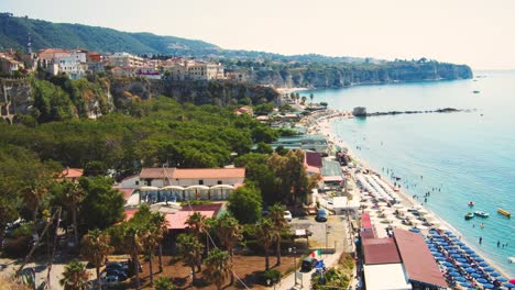 camera pan over an old town to the colorful beach - slow motion