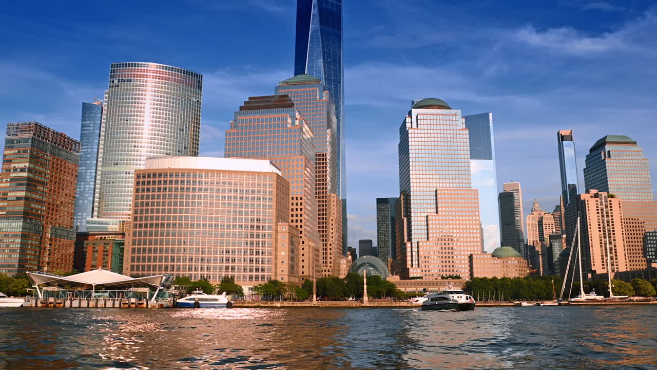 Modern design buildings at the waterfront of the river. Low angle view. Boat tour around New York, USA