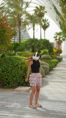 woman wearing vr headset in a park