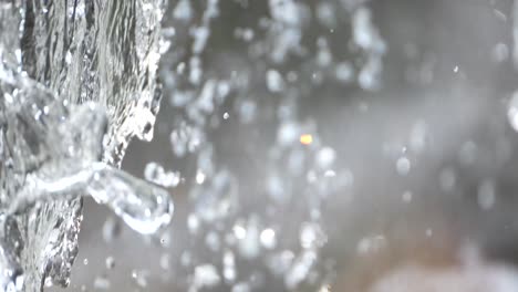 the clear flowing texture of water falling from a hight at close up