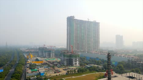 aerial drone shot capturing a massive construction site in noida india