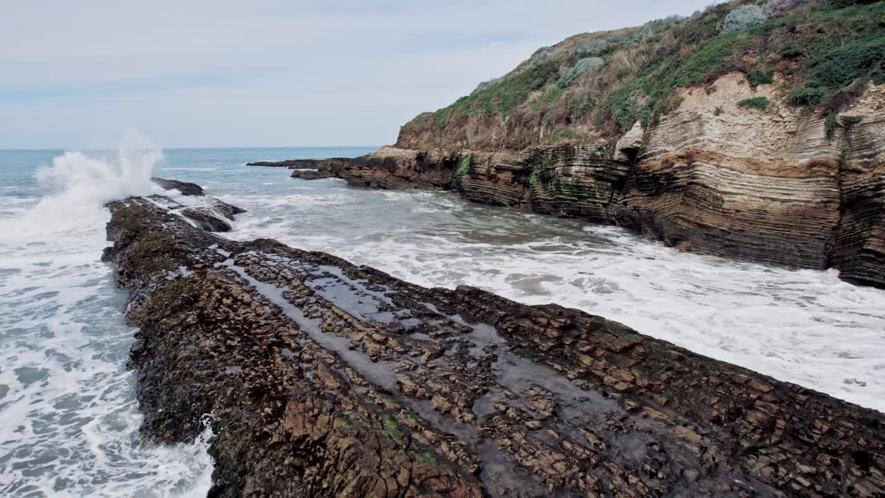 Dramatic Ocean Cliffs on the West Coast with Waves Crashing Against Rocks