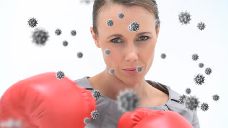 animation of virus cells floating over caucasian female boxing