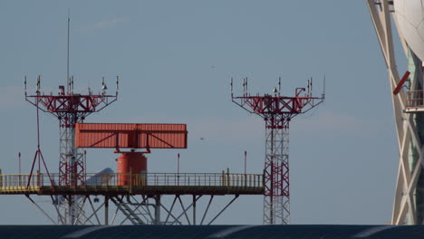 airplane taking off near air traffic control towers