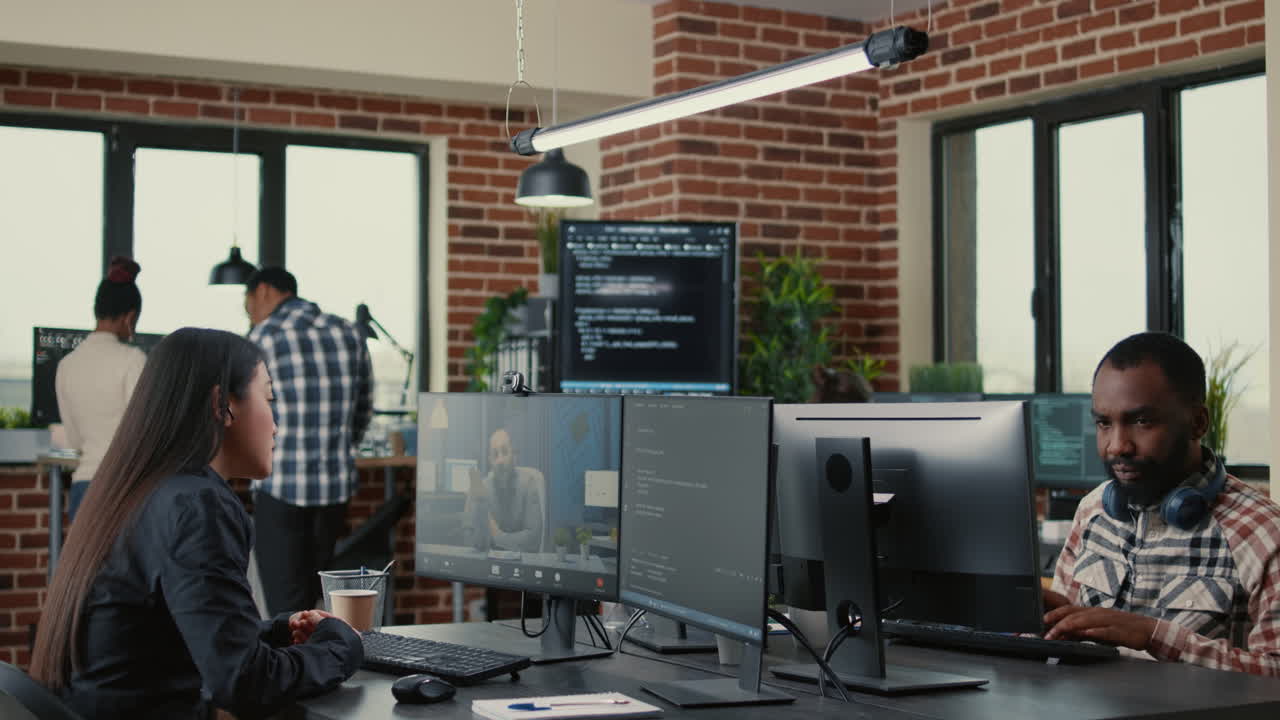Software company employee in video call conference with business owner discussing coding project deadline